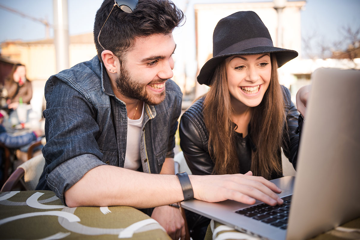 Young couple or friends together smiling happy and confident